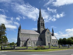 View of the front of St. Mary's Cathedral with a large tree located beside it